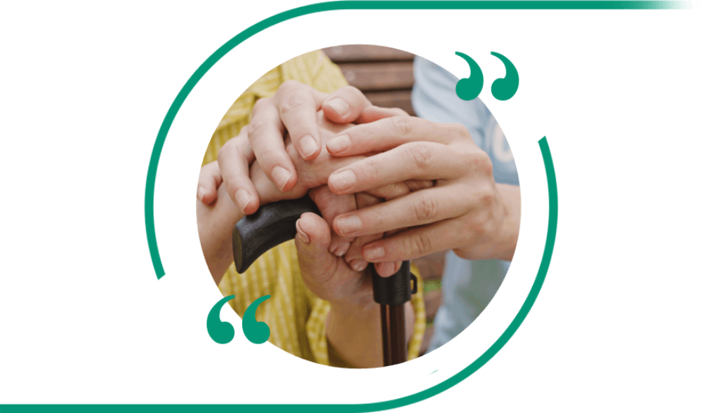 Hands overlapping on a cane