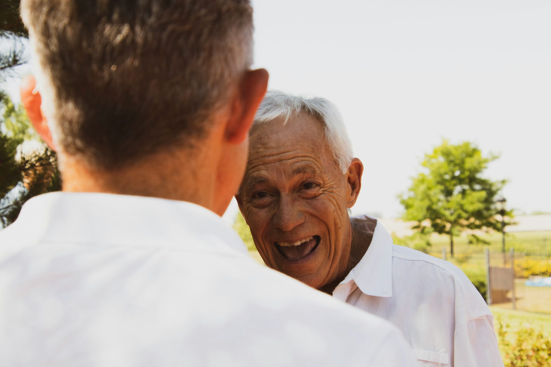 Older man smiling outdoors