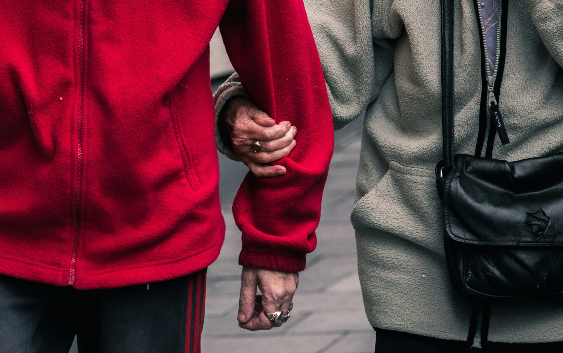 Hands holding in close embrace